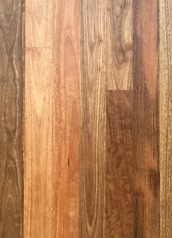 Australian Spotted Gum has brown tones, some creamy strips, and elegant cathedral grain interspersed with rippling fiddleback grain. ©.